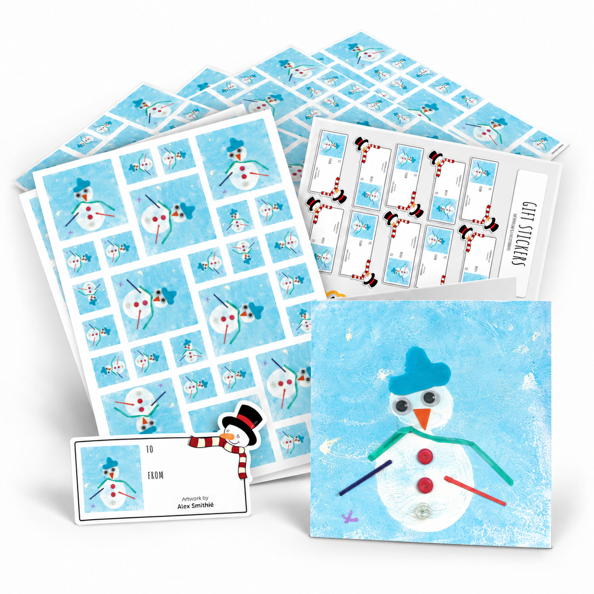 A coordinated smowman-themed gift set on a white background, including cards, envelopes, stickers and wrapping paper