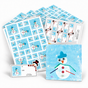A coordinated smowman-themed gift set on a white background, including cards, envelopes, stickers and wrapping paper