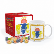A white ceramic mug with a colorful angel handprint design, shown next to its red gift box and a small pile of assorted fizzy sweets on a white background.